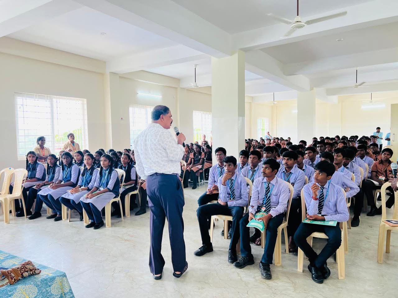 Guest speaker addressing senior students seated in the school auditorium
