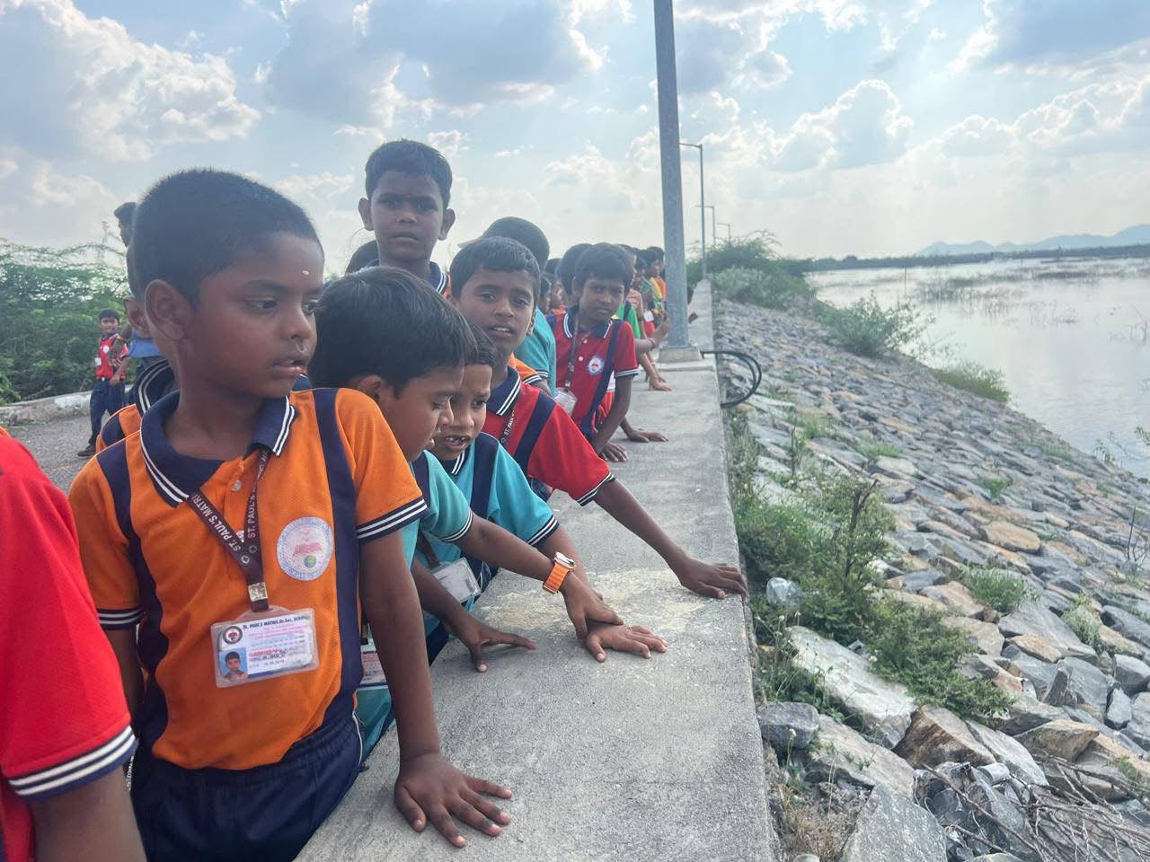 Students observing a reservoir during a geography field trip