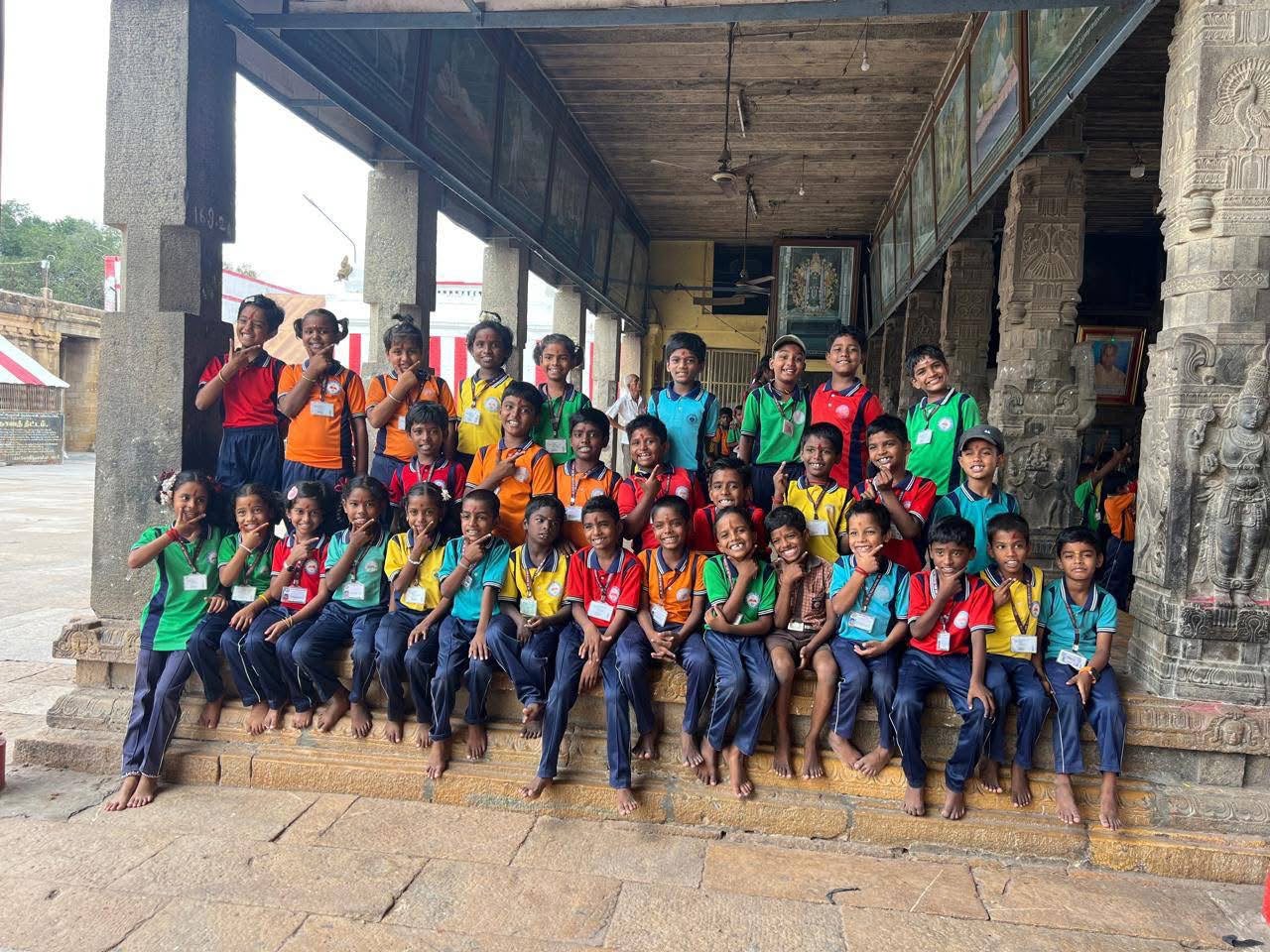 Students in colourful t-shirts on a heritage temple visit during a school excursion
